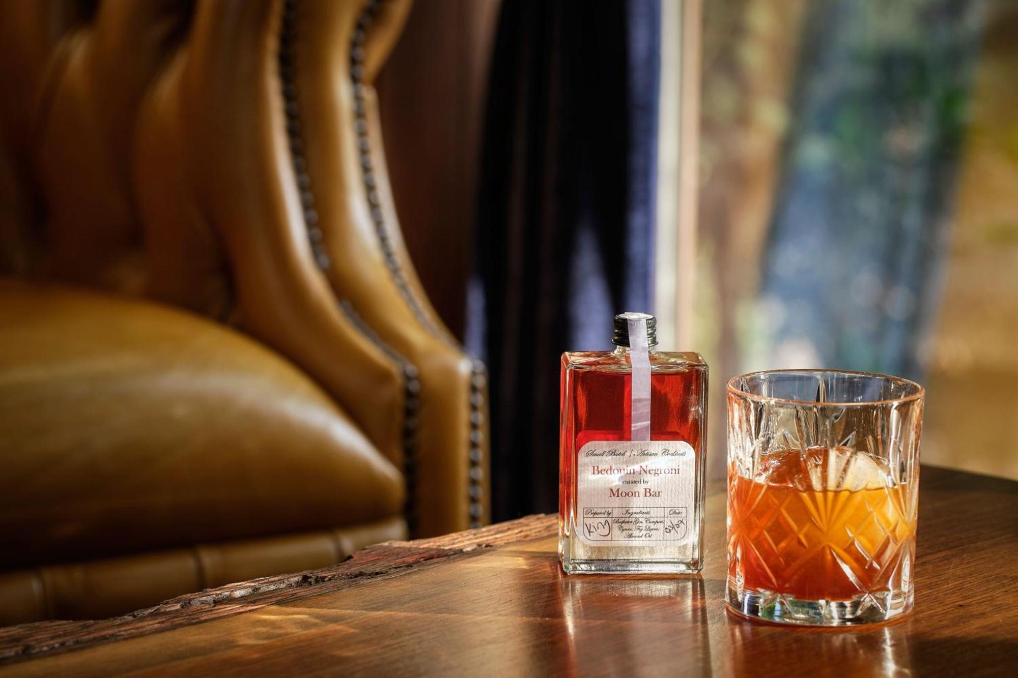 The Ritz-Carlton Ras Al Khaimah, Al Wadi Desert Bagian luar foto A bottle of Old fashioned cocktail syrup