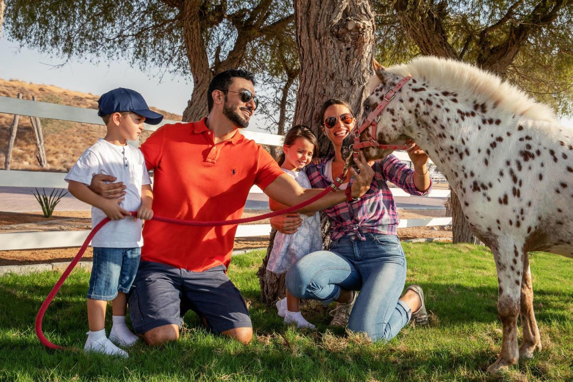 The Ritz-Carlton Ras Al Khaimah, Al Wadi Desert Bagian luar foto Family at the farm